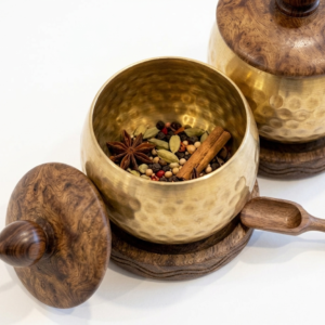 RB ARTISAN handcrafted brass hammered spice jar set of 3 with wooden base lid and spoon filled with salt cardamom and turmeric made in India