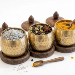 RB ARTISAN handcrafted brass hammered spice jar set of 3 with wooden base lid and spoon filled with salt cardamom and turmeric made in India
