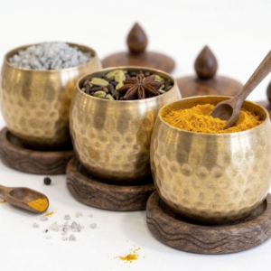 RB ARTISAN handcrafted brass hammered spice jar set of 3 with wooden base lid and spoon filled with salt cardamom and turmeric made in India
